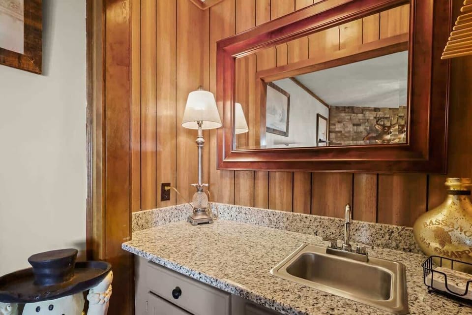 Living room charm: Sink into comfort, gather by the fireplace, and elevate movie nights with a smart TV.
