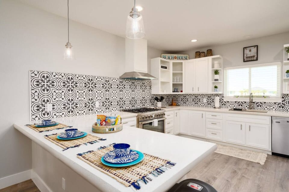 Bright and beachy kitchen — fully stocked for cooking up seaside feasts and morning coffee moments.