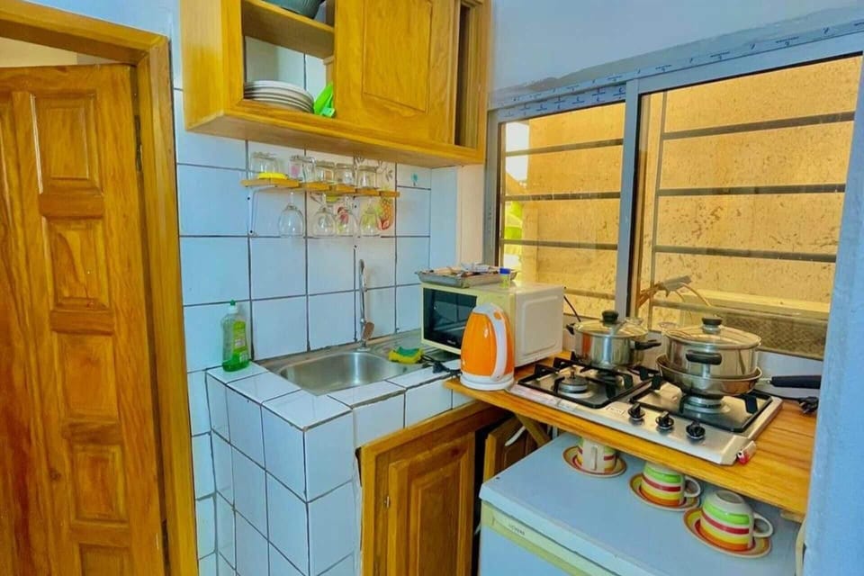 Fridge, electric kettle, cookware/dishes/utensils