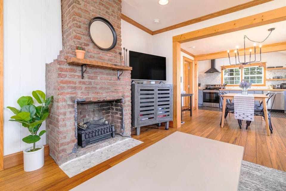 The fireplace adds a cozy touch to this inviting living room.