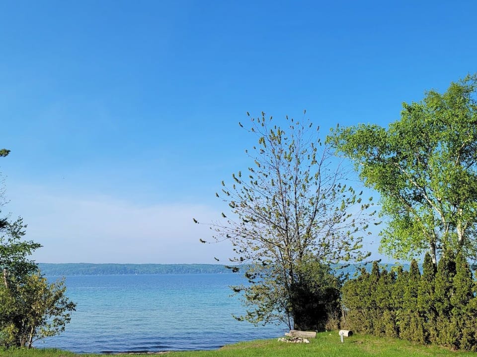 EXTERIOR:  Looking out at the private lakefront and Crystal Lake.