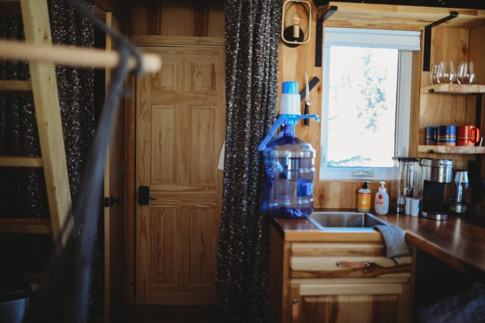 A fully equipped kitchen offers the essentials for cooking up delicious meals, with a rustic wooden design for a cozy and functional experience.
