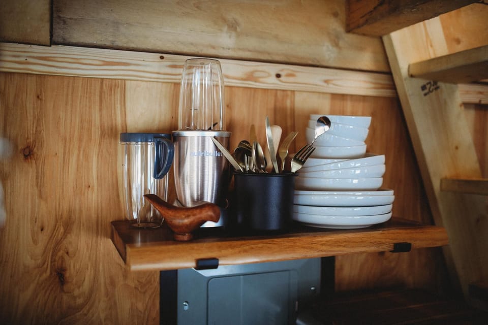 Stocked with all the essentials, including a blender, plates, and utensils, making it easy to cook and enjoy meals during your stay in the heart of nature.