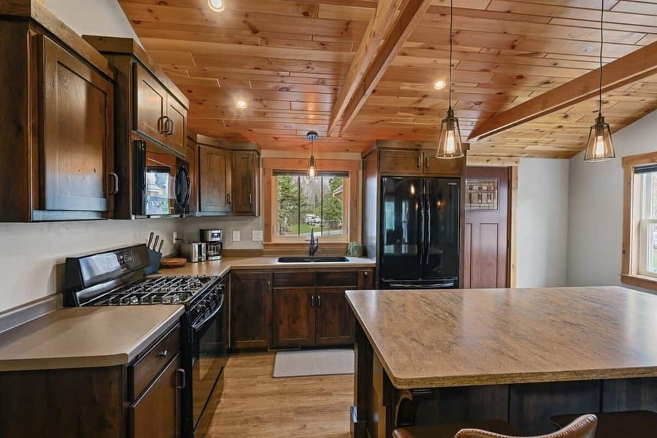 Thoughtfully designed kitchen with rich wood finishes.