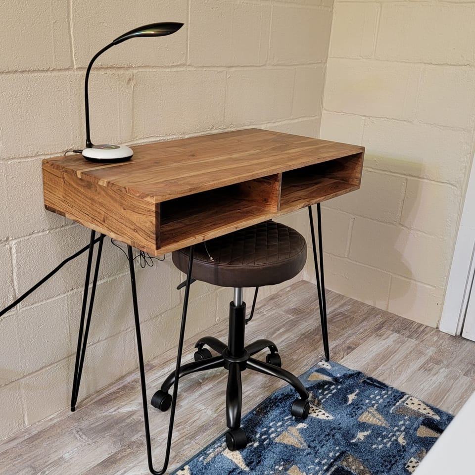 Desk has a USB port for your laptop or tablet. 