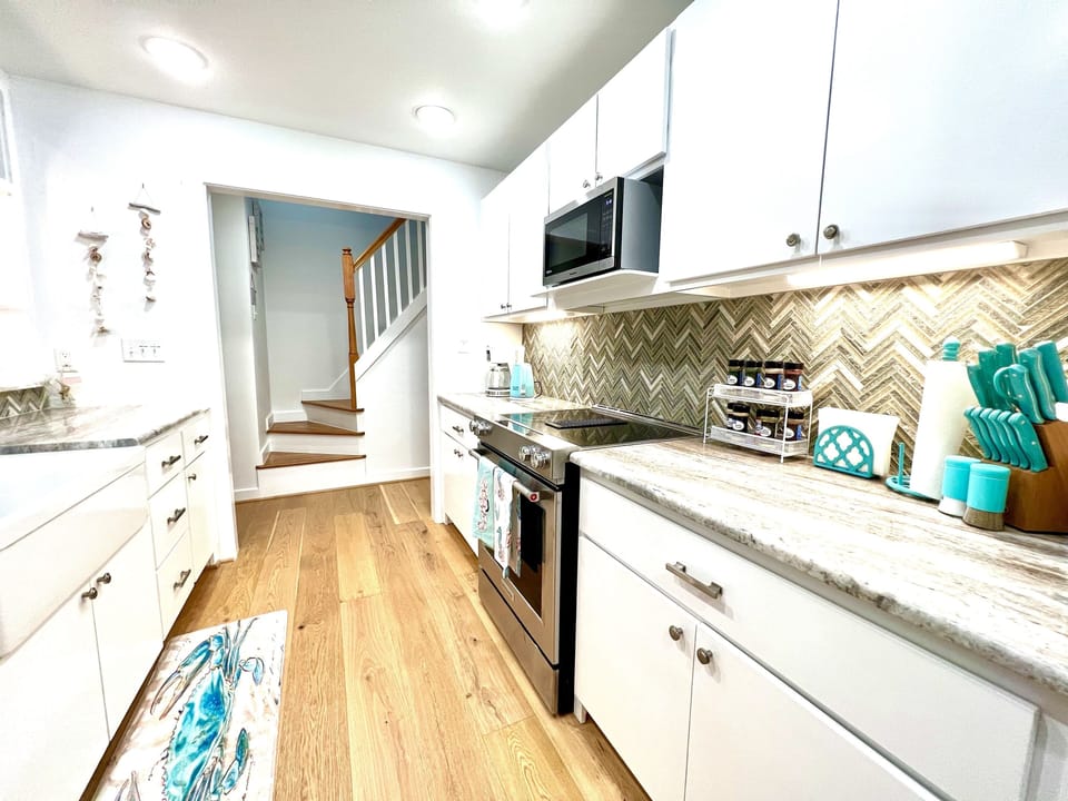 Fully stocked kitchen with utensils and condiments to cook your favorite meals.