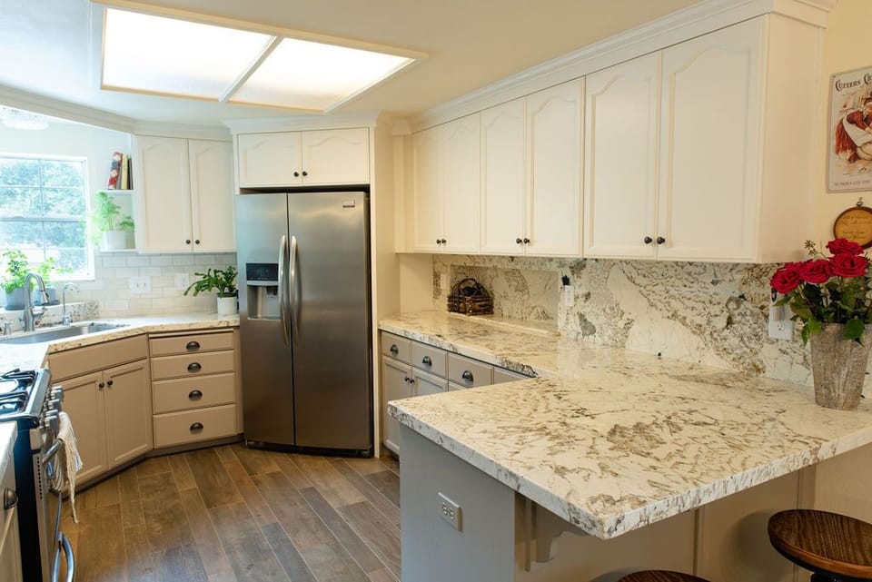 Newly remodeled kitchen with exotic granite countertops. 