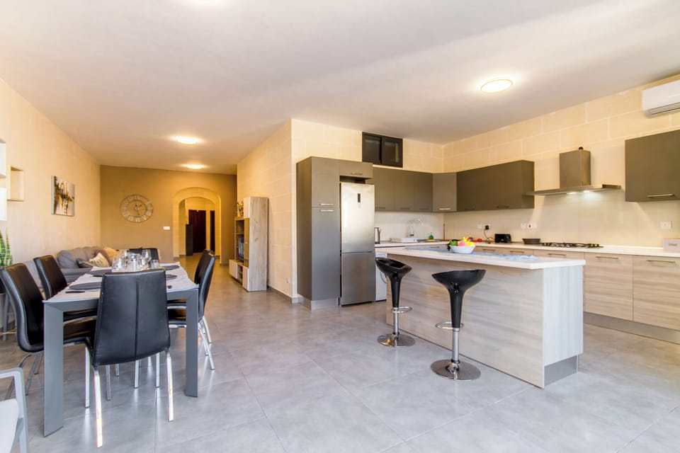 Family House, Multiple Bedrooms (Ta'Siku Gozitan villa + Pool & hot) | Private kitchen | Fridge, microwave, oven, stovetop