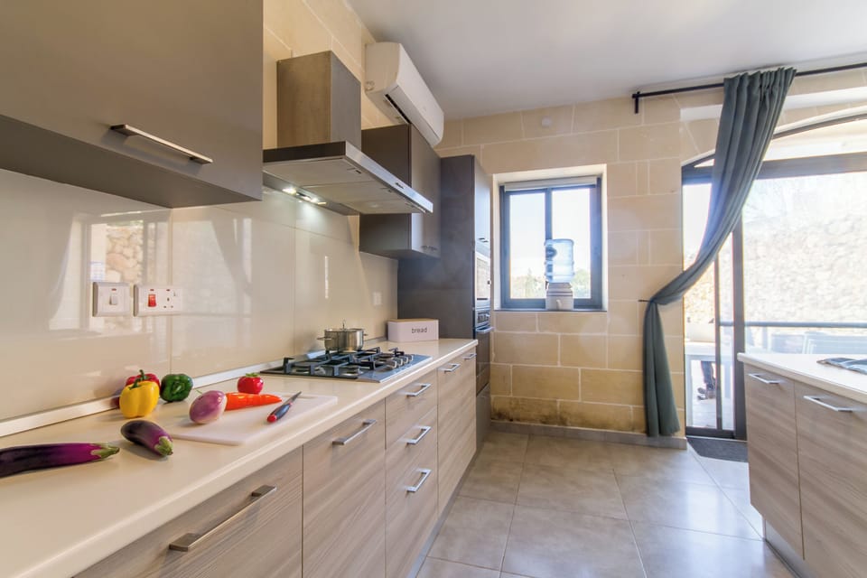 Family House, Multiple Bedrooms (Ta'Siku Gozitan villa + Pool & hot) | Private kitchen | Fridge, microwave, oven, stovetop