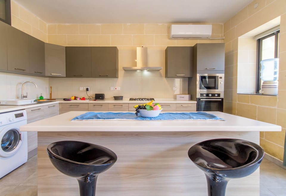 Family House, Multiple Bedrooms (Ta'Siku Gozitan villa + Pool & hot) | Private kitchen | Fridge, microwave, oven, stovetop