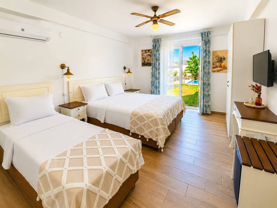 Standard Triple Room, Balcony, Pool View | Hypo-allergenic bedding available, minibar, in-room safe