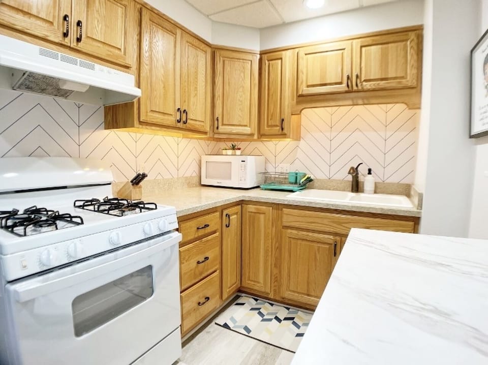 Kitchen utensils and cookware provided. 