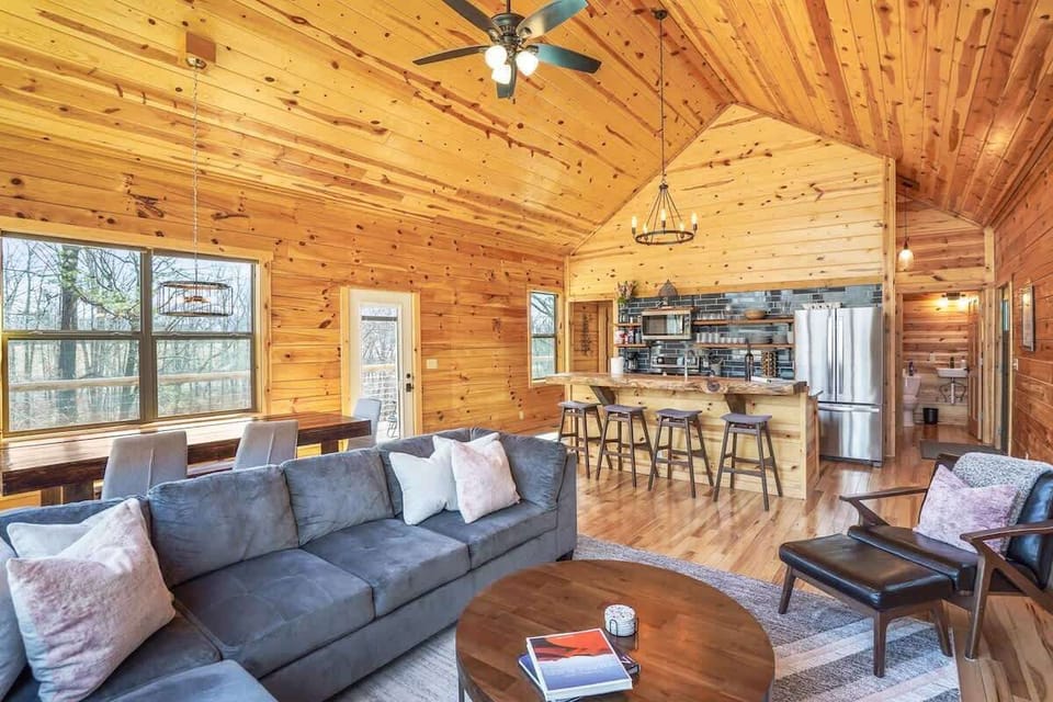 Living Room: Sunlit haven with wood accents, perfect for relaxation and gathering with loved ones!