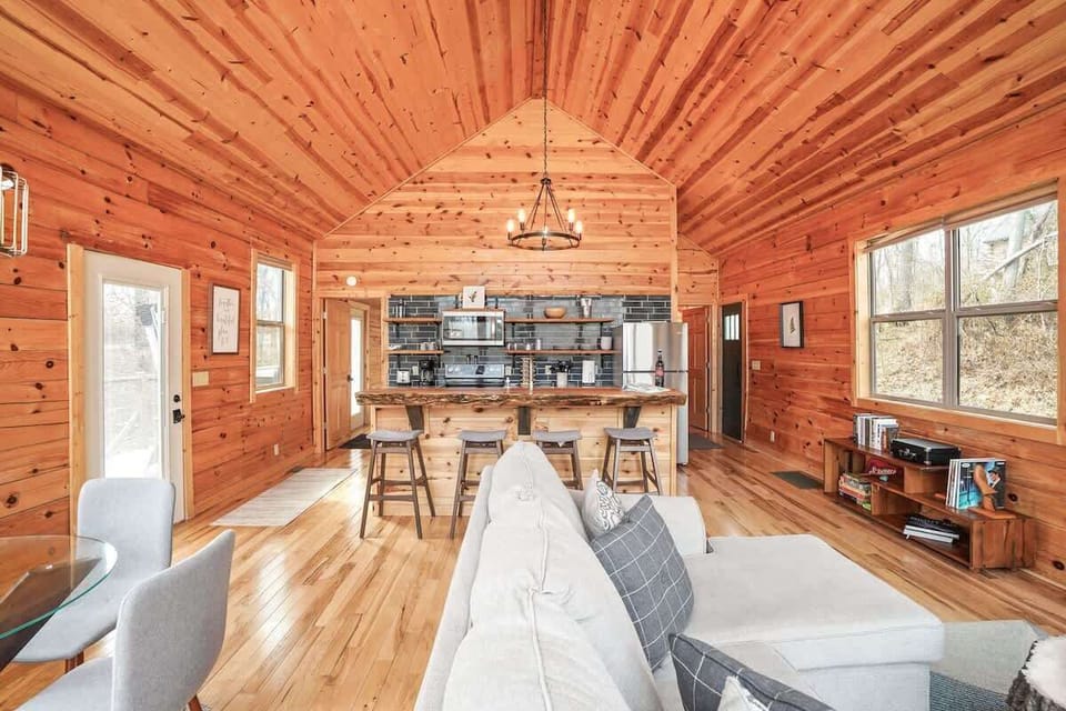 Living Room: Bright wood accents and an open layout invite relaxation and connection with nature!
