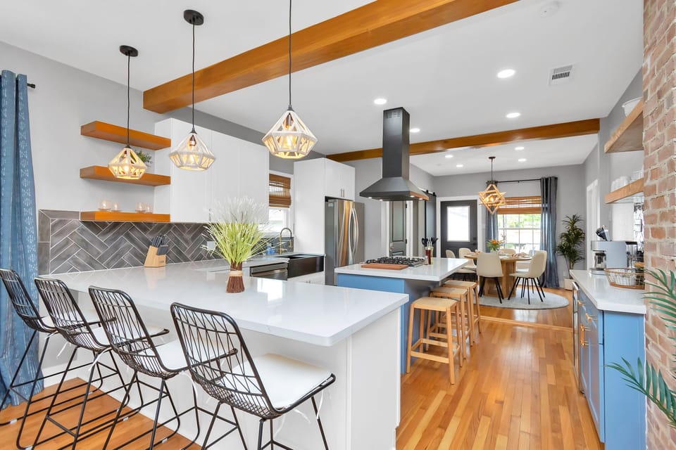 Open concept kitchen and dining area with ample seating for all guests.