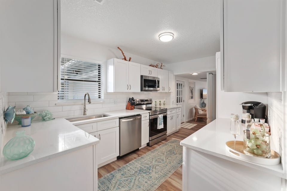 Bright, modern kitchen designed for easy meals, morning coffee, and gathering together