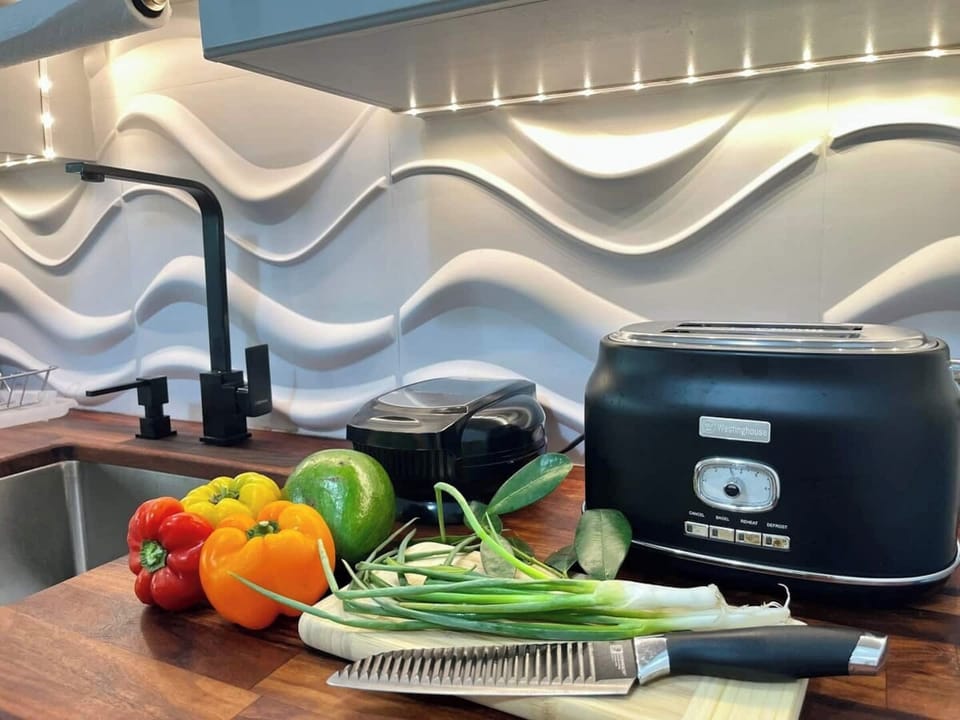 This kitchen is not just stylish, it’s functional. You can even snip some herbs from our private patio to add to a pot or 2. 