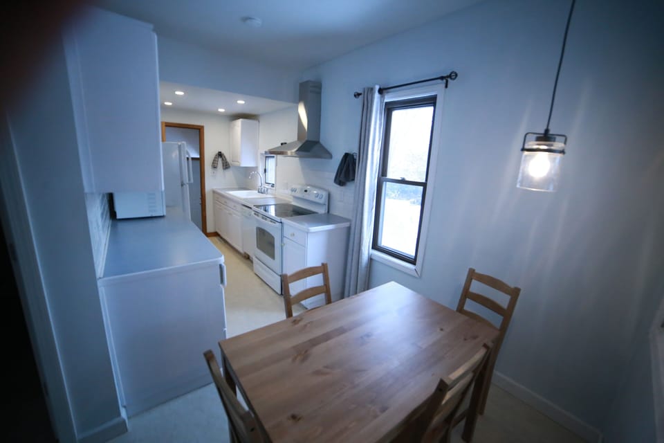 Farmhouse kitchen with eat in table for 4.