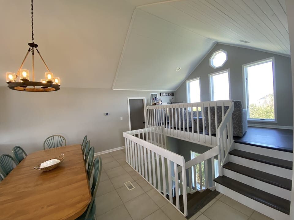 Top floor kitchen table and loft area. Open concept.