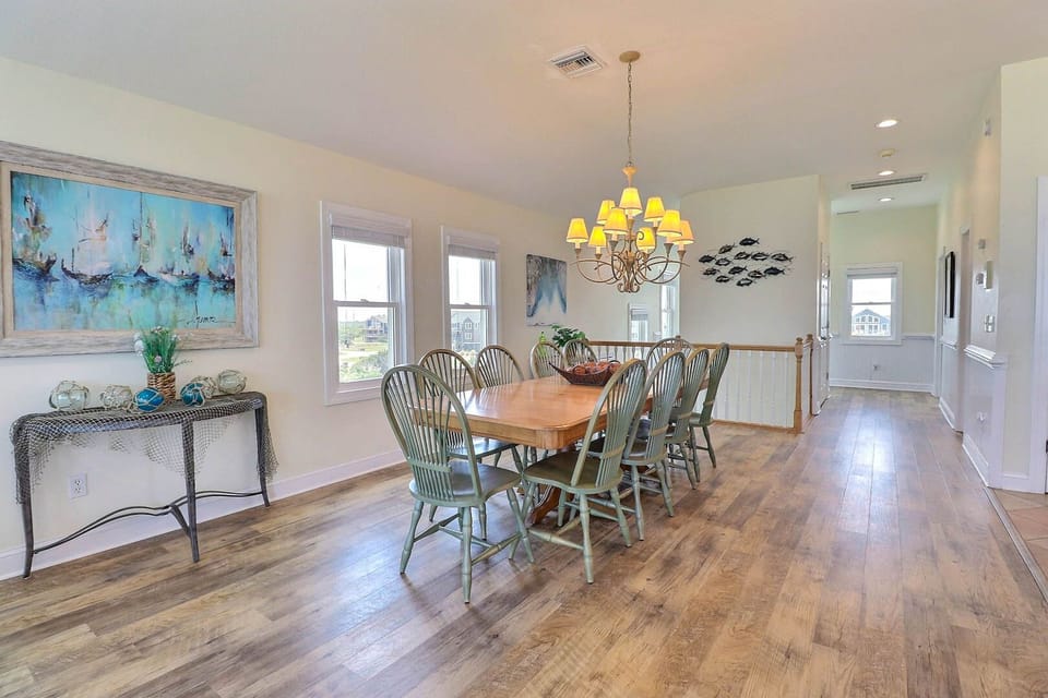 Seating for 14 is provided in the dining area with dining tables.