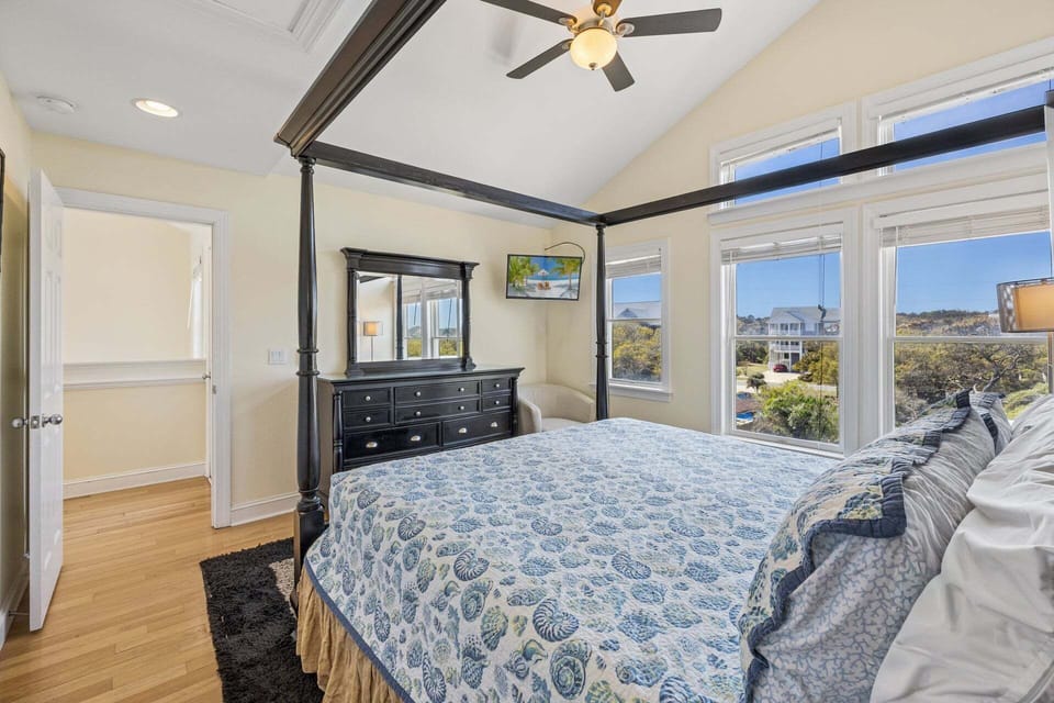 Retreat to the gorgeous Master Bedroom with high ceilings when you're ready to relax for another day of exploring the Outer Banks.