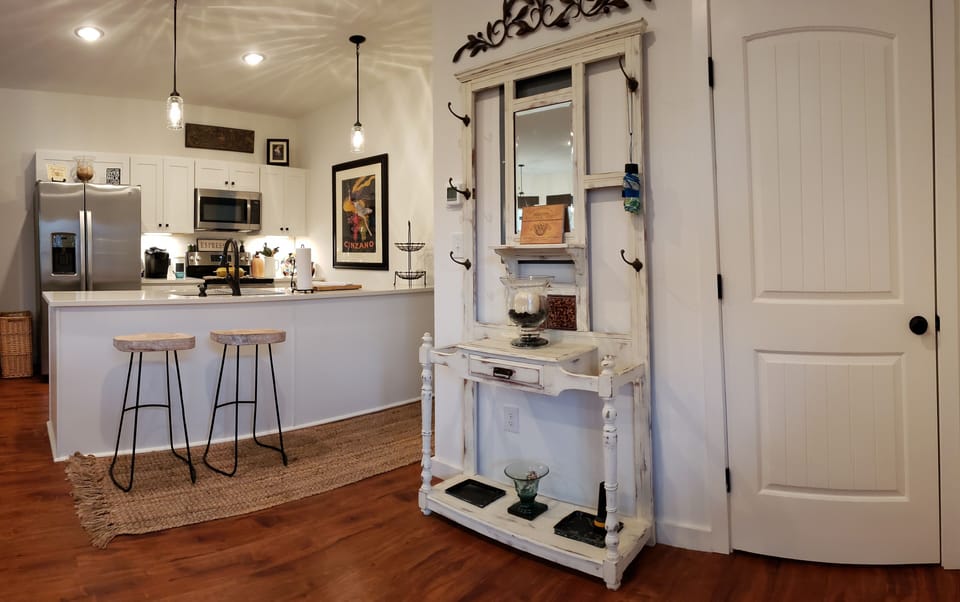 Entry area, kitchen, hall to half bathroom & stairs to second floor.