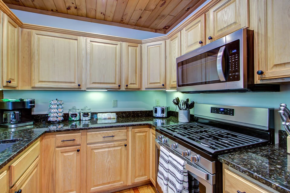 Standard stainless steel appliances with a fully stocked kitchen.  