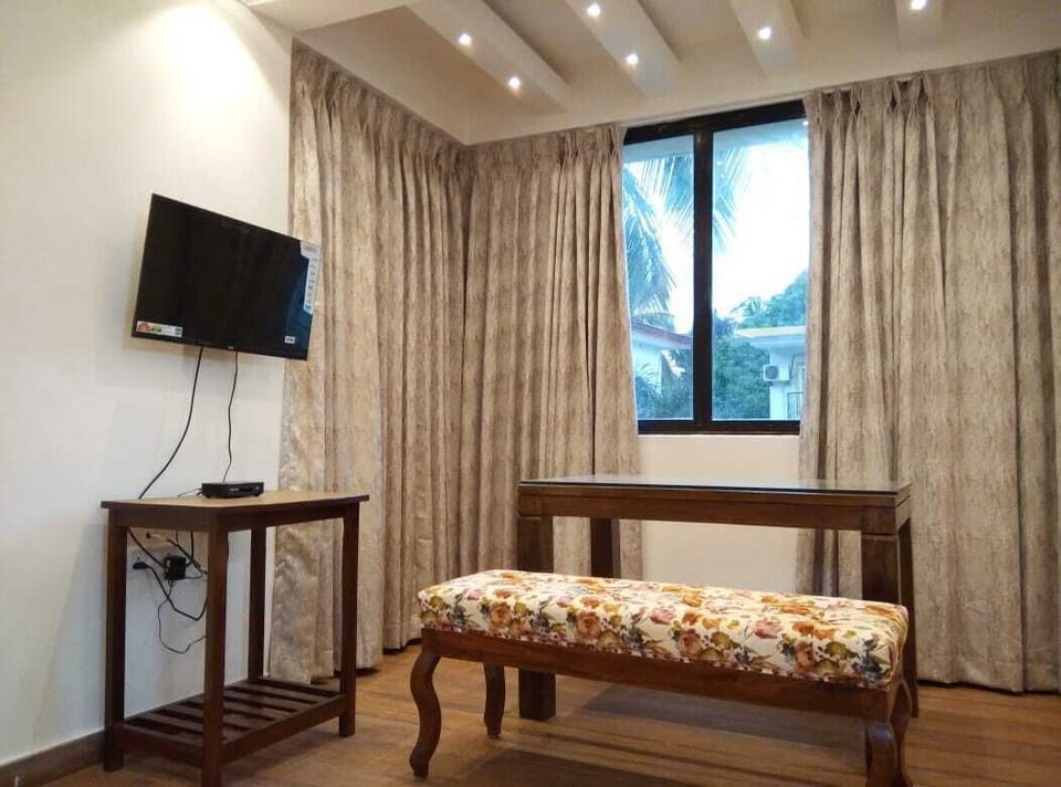 Luxury Room, Pool View | Living area | 32-inch LCD TV with satellite channels, TV