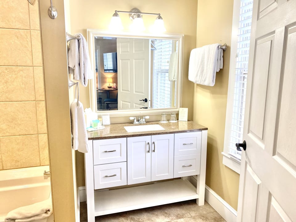 Room, 1 King Bed with Sofa bed, Jetted Tub | Bathroom | Hair dryer, towels