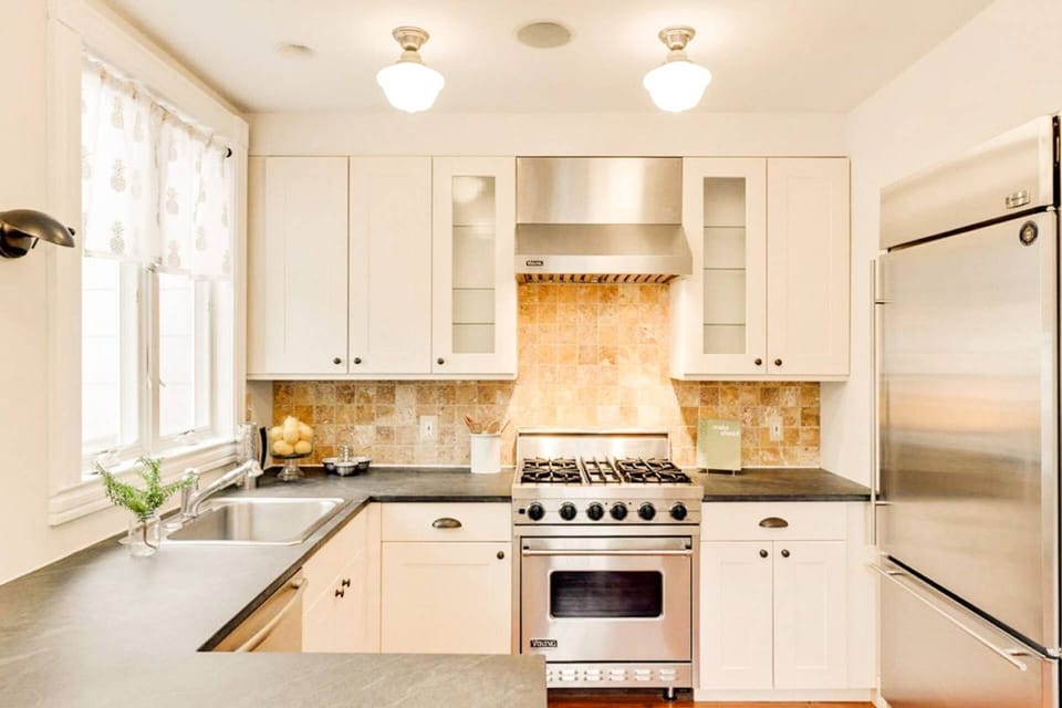 The stunning gourmet kitchen features all high-end finishes.