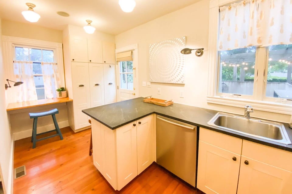 The kitchen has seating for 3 more at the counters.