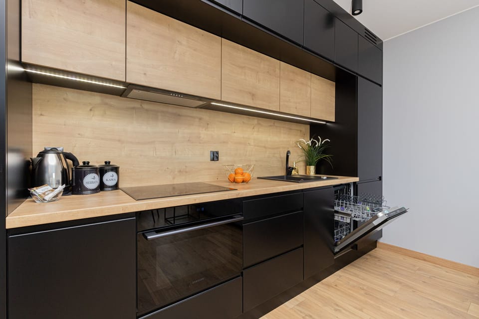 A focus on the kitchen's functionality, showcasing built-in appliances and plenty of countertop space. The modern design emphasizes usability and aesthetic.