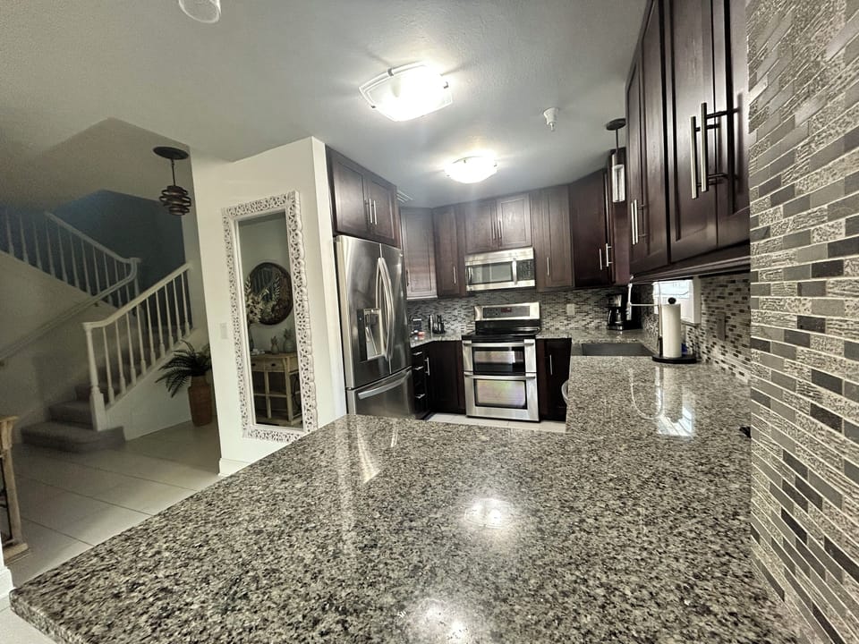 Open kitchen offering ample counter space and a seamless flow to living areas