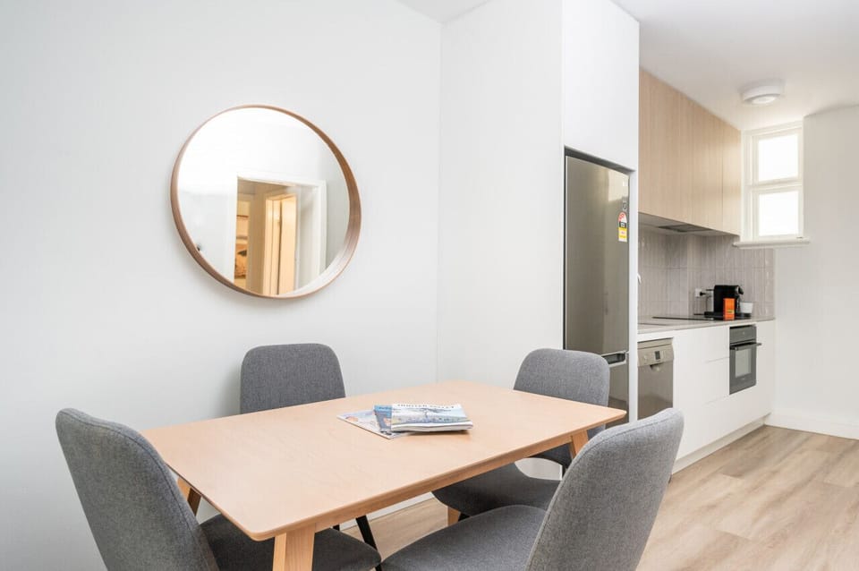 Open-plan dining onto the kitchen. A round mirror to see your beautiful reflection before exploring the area!