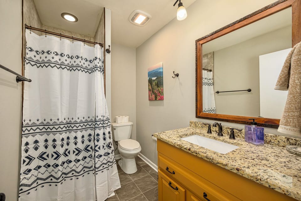 Upstairs full bathroom with shower stall.