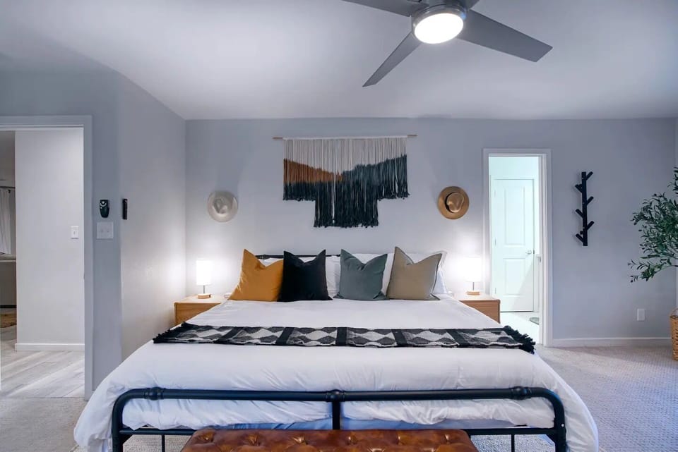 Primary bedroom with a king-sized bed and on-suite bathroom.