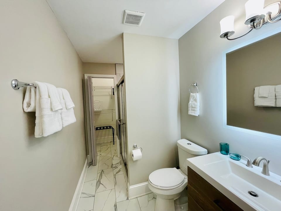 Master bedroom features a private bathroom w/ stand up shower