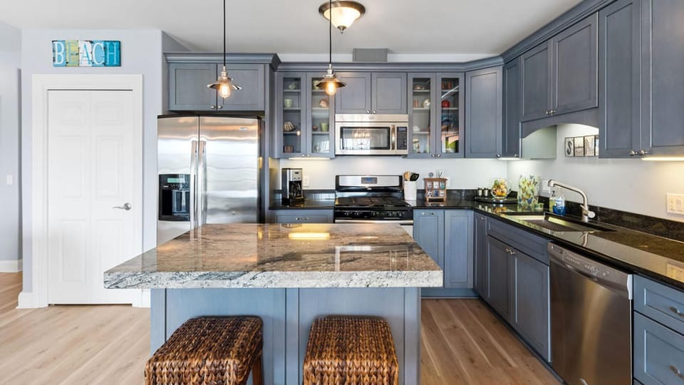 Modern kitchen with spacious island open to the great room