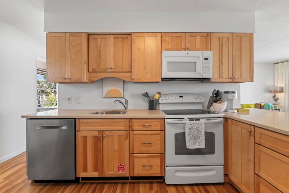 The upstairs kitchen at Sunshine’s Happy Place is bright, spacious, and fully equipped—perfect for preparing meals to share with the whole crew. With space for up to 8 guests in the full home, it’s designed for connection, comfort, and coastal living.