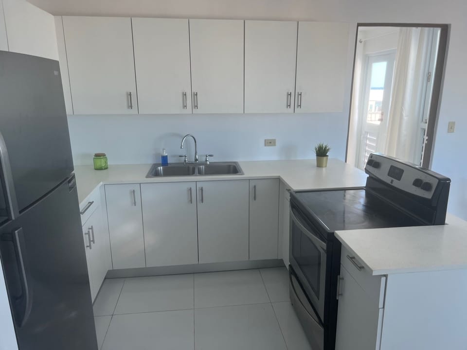 Fridge, microwave, cookware/dishes/utensils
