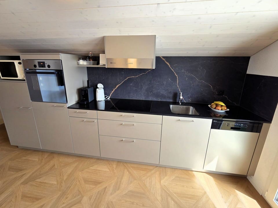 Flooring, Wood, Floor, Kitchen, Countertop, Kitchen Appliance, Furniture, Cabinetry, Interior Design, Wood Flooring