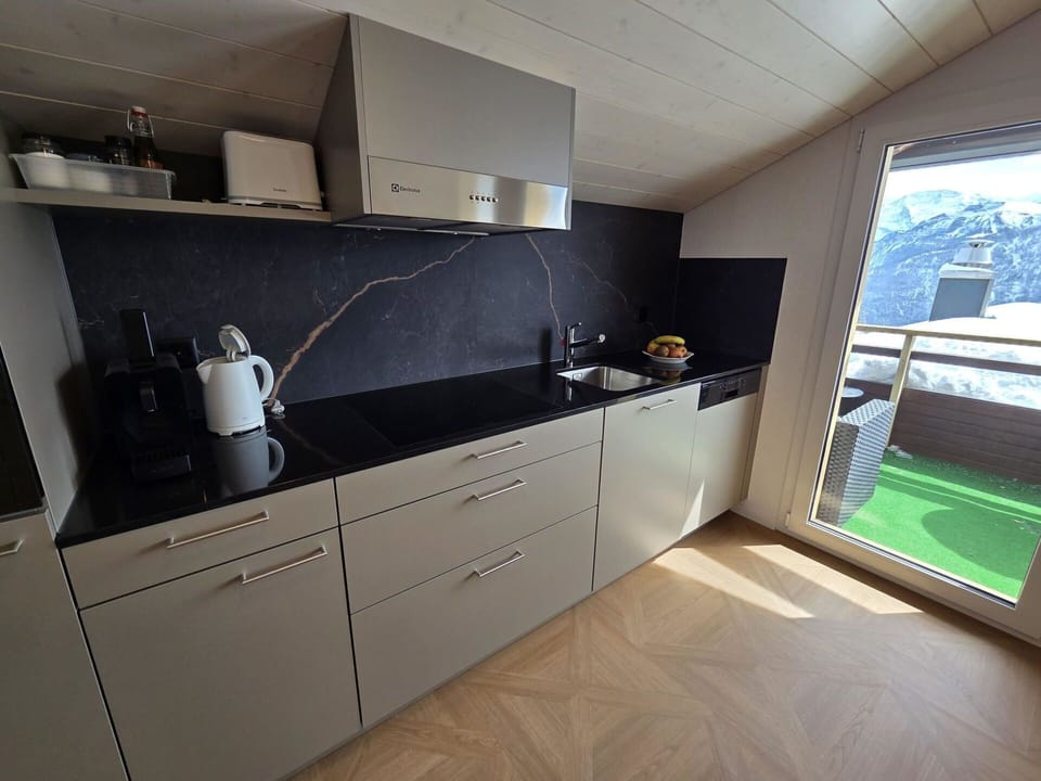 Flooring, Wood, Countertop, Kitchen, Floor, Cabinetry, Interior Design, Kitchen Appliance, Furniture, Major Appliance