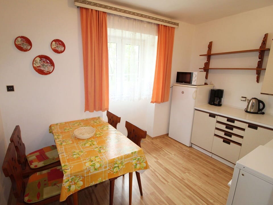 Furniture, Property, Table, Cabinetry, Curtain, Wood, Window, Interior Design, Chair, Flooring
