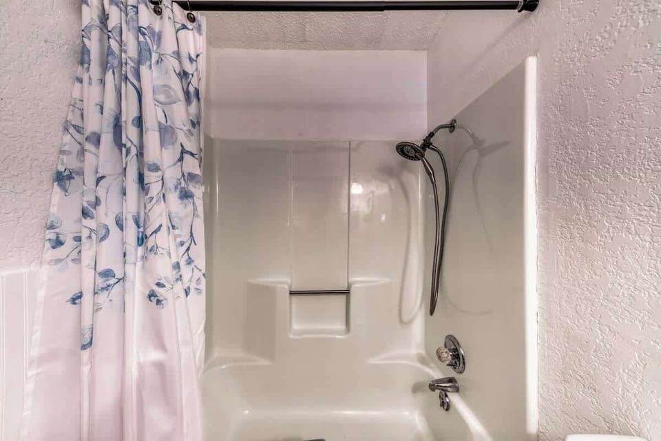 Hallway guest bathroom. Shower/Tub combo in Whispering Woods