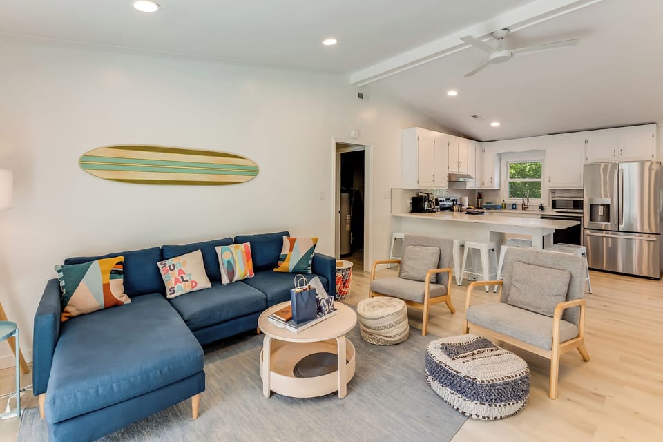 Large living room area with 50" smart TV, board games, books.
