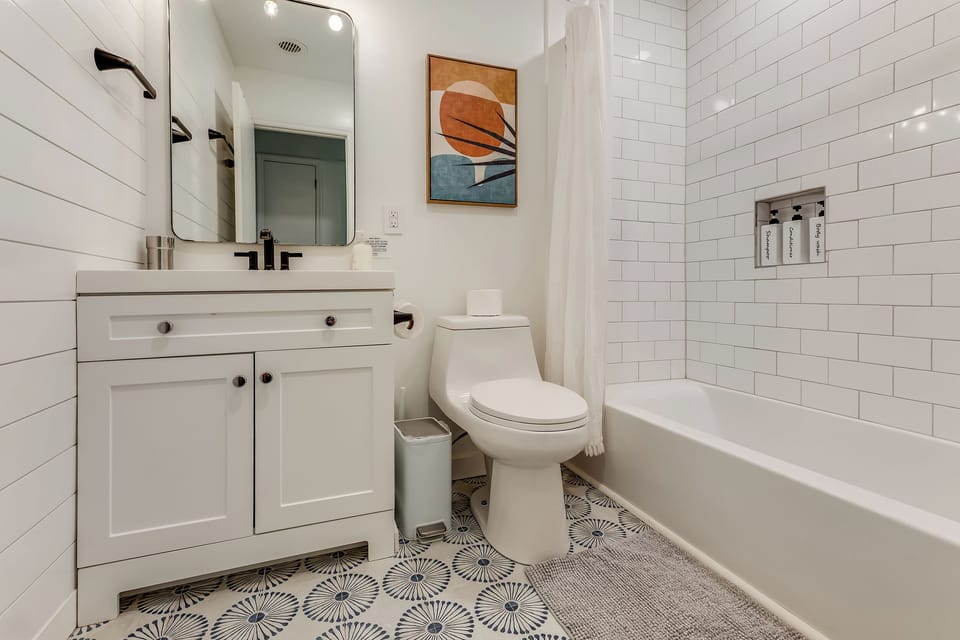 Hall bathroom with large tub.