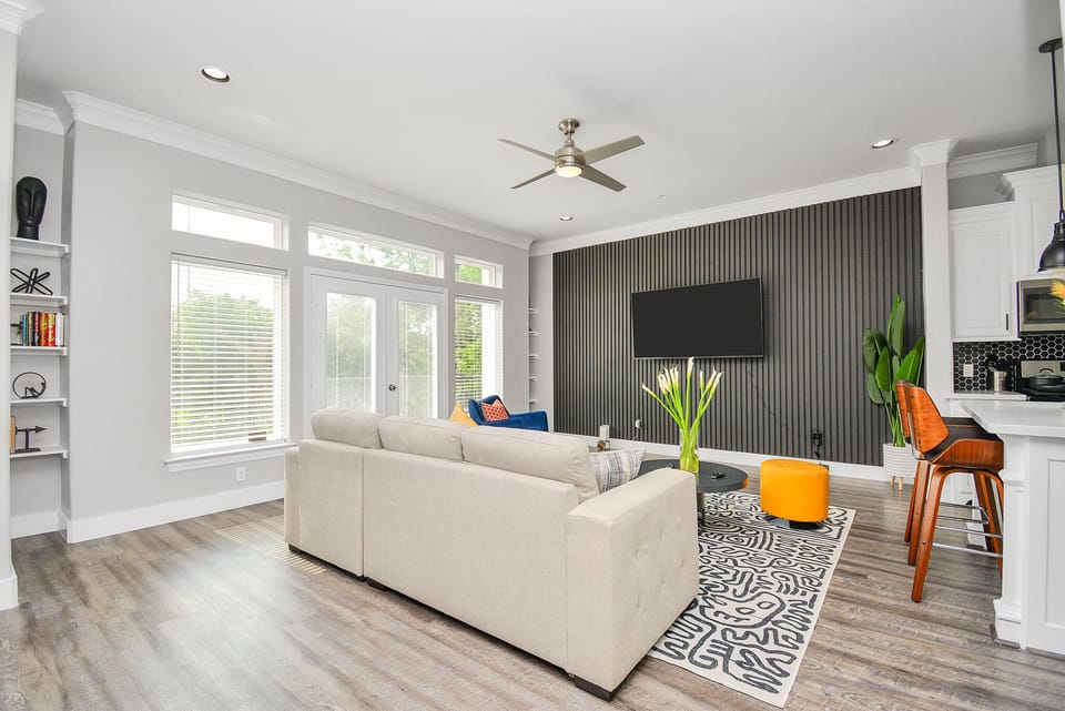 Relax in this super contemporary living room and enjoy the 70" smart TV