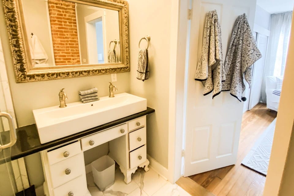 There are a set of clean bath towels for every guest in the home.