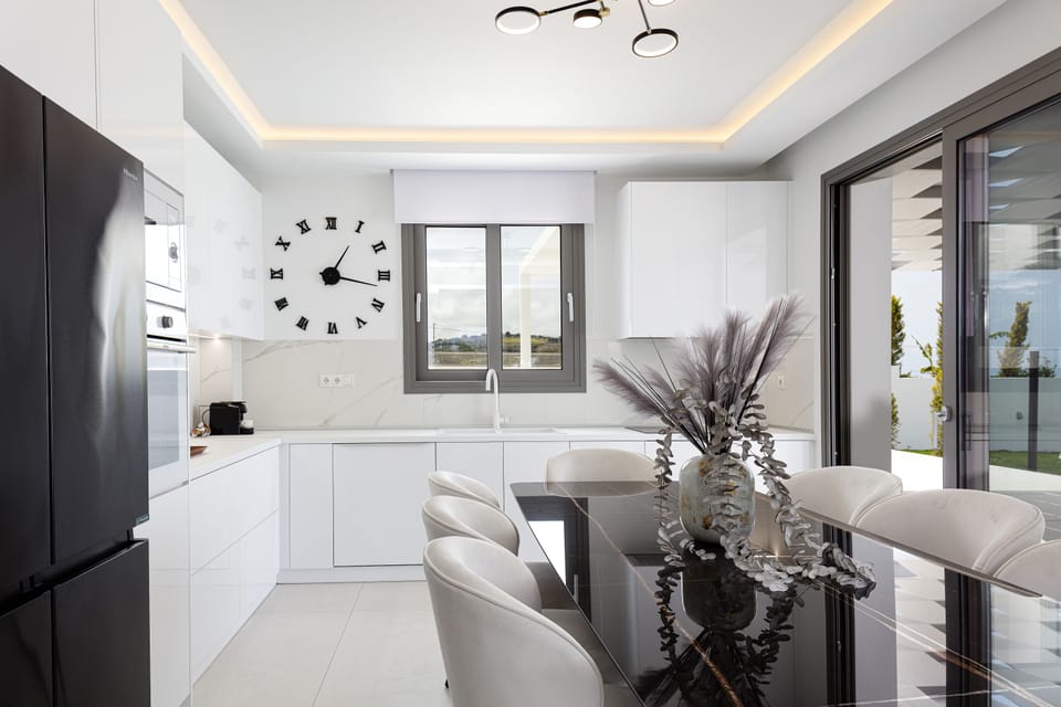 The indoor open plan kitchen and dining area await to inspire your culinary self