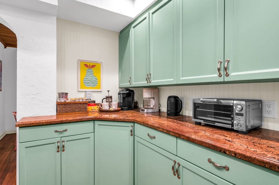 The Kitchen is brightly painted and a pleasure to cook in. It has everything you need to create a fabulous home-cooked meal for family or friends. There is a gas range, stainless steel stove and oven, Keurig, kettle, and blender.